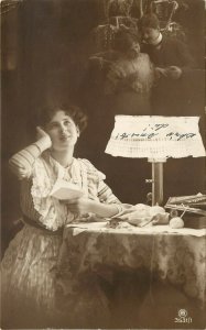 c1910 RPPC Beautiful Woman Reads Letter by Lamplight Dreams of her Lover, Europe