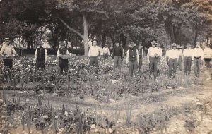 Gathering Flowers for Memorial Day Cemetery Decorations Real Photo PC AA22906