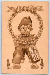 Wall Signed Artist Postcard Christmas Dutch Boy With Tag Berries Wreath c1910's