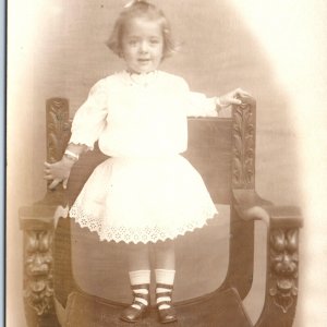 c1910s Cute Little Girl RPPC Stand Fancy Wood Carved Chair Real Photo Child A185
