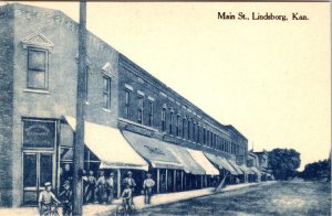 Lindsborg KS Kansas MAIN STREET SCENE Men~Bikes~Drug Store McPHERSON CO Postcard