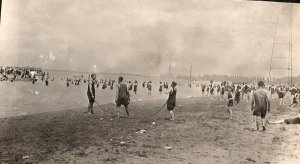 c1910 BEACH SCENE GUYS JUMPING ROPE BEACH CITY IN BACKGROUND RPPC POSTCARD P289