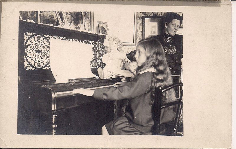 RPPC Cute Little Girl Playing Piano with Doll, UK, ca. 1910 (?) Mother & Child
