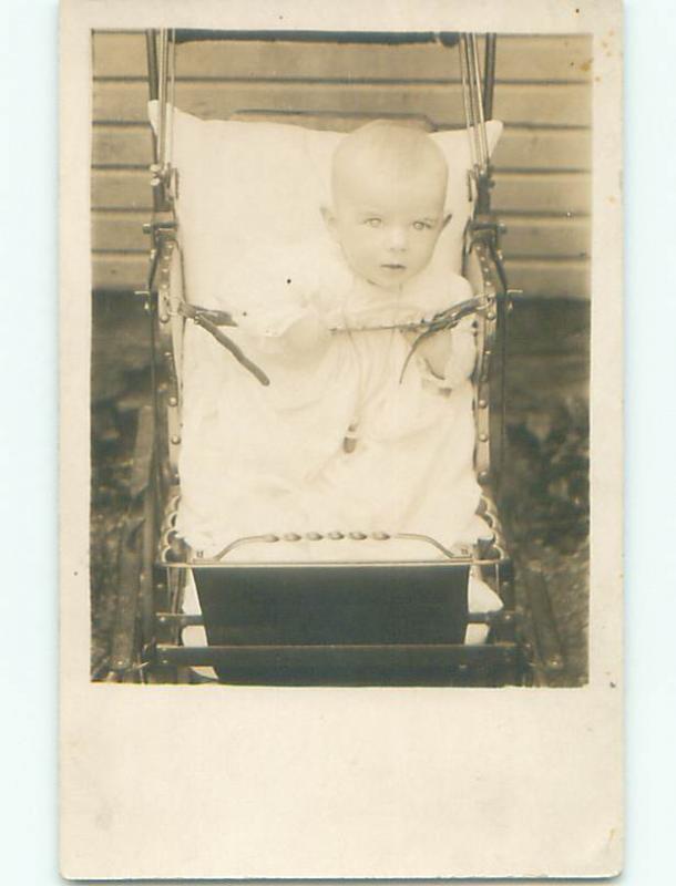 Pre-1918 rppc WIDE EYED BABY STARES INTO THE CAMERA o1933