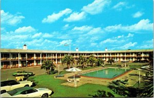 VINTAGE POSTCARD SOUTHERN INN MOTEL CLASSIC CARS BYRON BUTLER PARKWAY PERRY FLOR