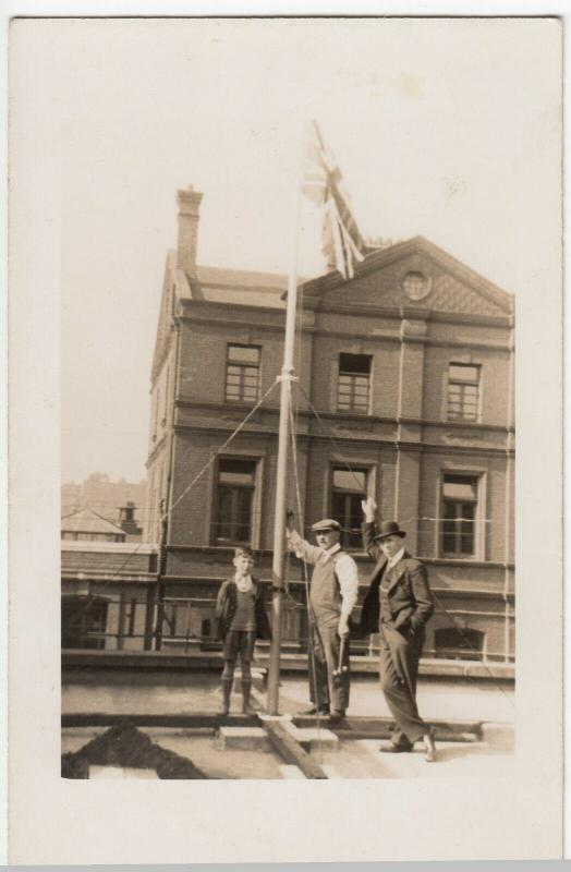 Social History; Unlocated Group Raising Union Flag, c 1920's RP PPC Unused