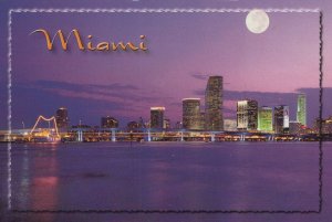 America Postcard - Florida - Miami - The City Lights Up as The Sun Sets  RRR481