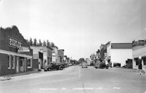 RPPC HWY 30 CLARENCE IOWA  GAS PUMP MOTOR GARAGE DODGE REAL PHOTO POSTCARD 1952
