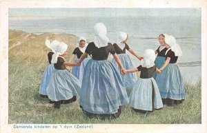 Lot 47  netherlands types folklore zeeland costume dancing children on the dune