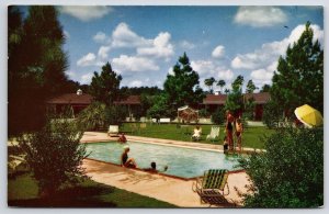 Slumberland Motel Orangeburg South Carolina SC Swimming Pool And Trees Postcard