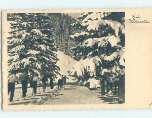 1946 rppc skiing LINE OF CROSS-COUNTRY SKIERS AT CHRISTMAS IN GERMANY HM0935