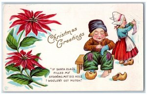 Christmas Postcard Dutch Kids Hanging Stocking Poinsettia Flowers Embossed