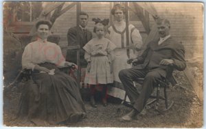 c1910s Nice Family Outdoors RPPC Wood Swing Chairs Cute Girl Real Photo PC A139