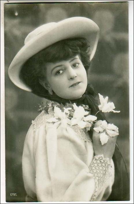 Pretty Girl Holding a Flower   *RPPC