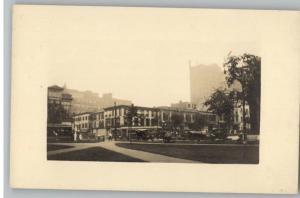 Old RPPC Postcard-Unknown Street Scene..Bldgs..Old Cars