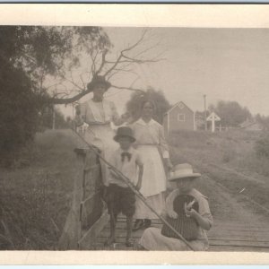 c1910s Cute Girl w/ Fish RPPC Fishing Fly Family Real Photo Bridge Postcard A126