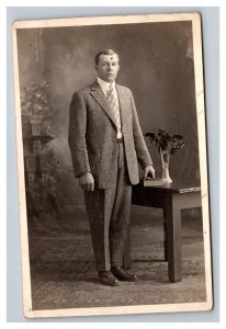 Vintage 1910's RPPC Postcard - Portrait Victorian Man Suit Table Flowers Bible