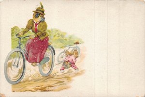 Mother dog riding bicycle puppy dog has accident 1900s anthropomorphic postcard