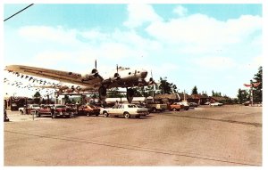 The Bomber worlds largest computerized filling station Oregon Airplane Postcard