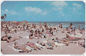 Bathing and Sun-Tanning on Beautiful Miami Beach, Miami, Florida, United Stat...