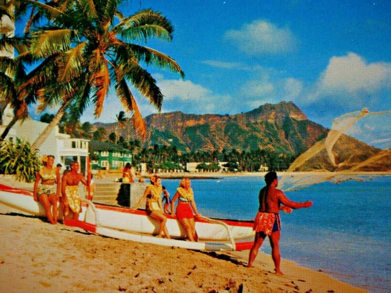 Waikiki Beach, Honolulu, Hawaii Man Throwing Net Women Sitting on Boat Postcard