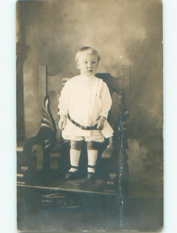 Pre-1918 rppc KID STANDS ON CHAIR Studio In Newark New Jersey NJ i9325
