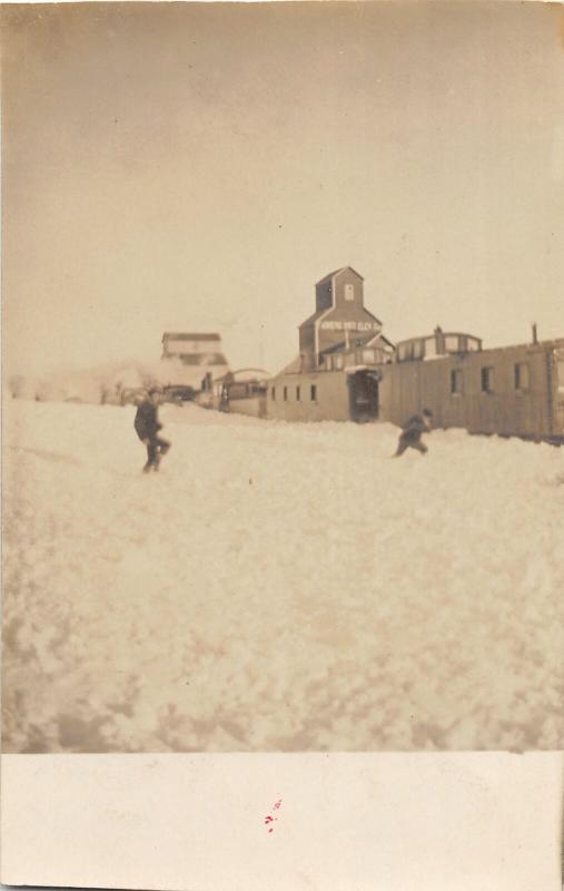 F35/ Garwin Iowa RPPC Postcard c1910 Snow Elevators Railroad