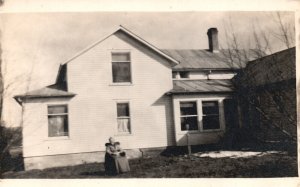 Postcard Woman in Long Dress Sitting in Chair w/ White House Chimney Background