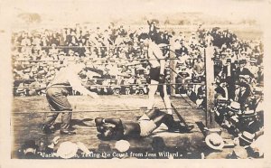 Jack Johnson Taking the count from Jess Willard, advertising on back Boxing U...