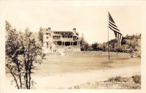 Black Hills South Dakota~State Game Lodge?~Large American Flag~c1930s RPPC