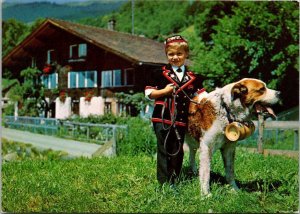 Switzerland Bern Young Boy In Traditonal Costume With St Bernard