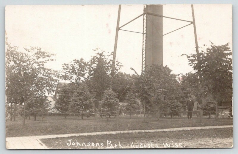 Augusta Wisconsin~Johnson's Park~Man Standing Below Water Tower~c1912 RPPC 