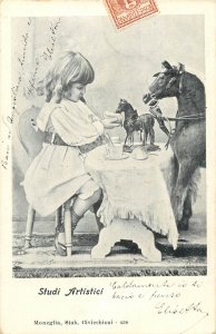 Children scenes artistic study postcard girl playing with toy horses Italy 1904