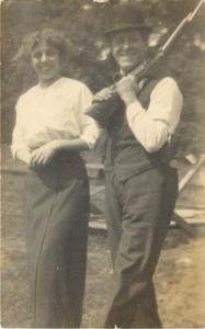 c1910 Real Photo Postcard; Smiling Woman & Man with Derby Hat & Rifle, Unposted