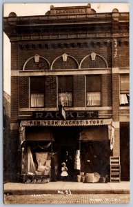 K45/ Ionia Michigan RPPC Postcard c1910 New York Racket Store Pratt 318