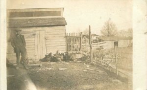 RPPC Postcard Illinois Elgin Man backyard Chickens 23-4626