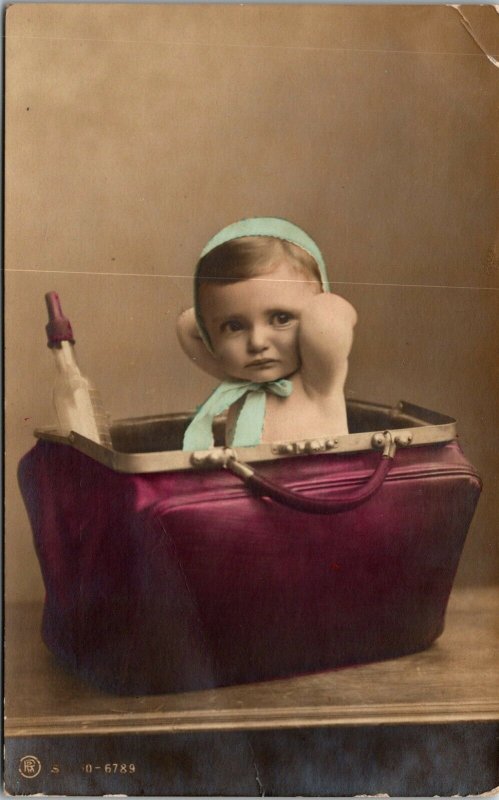 RARE - POSTCARD ADDRESSED to  Dr. Ida Heiberger - Baby in a purse - POSTED RPPC