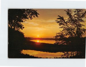 Postcard A beautiful sunset throwing shadows water and land, Vacationland Scene