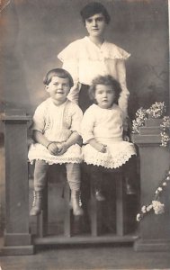 Woman with Two Children Real Photo Writing on Back 