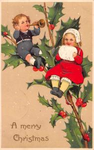 Christmas Greetings Children on Holly Leaves PFB Antique Postcard J61717