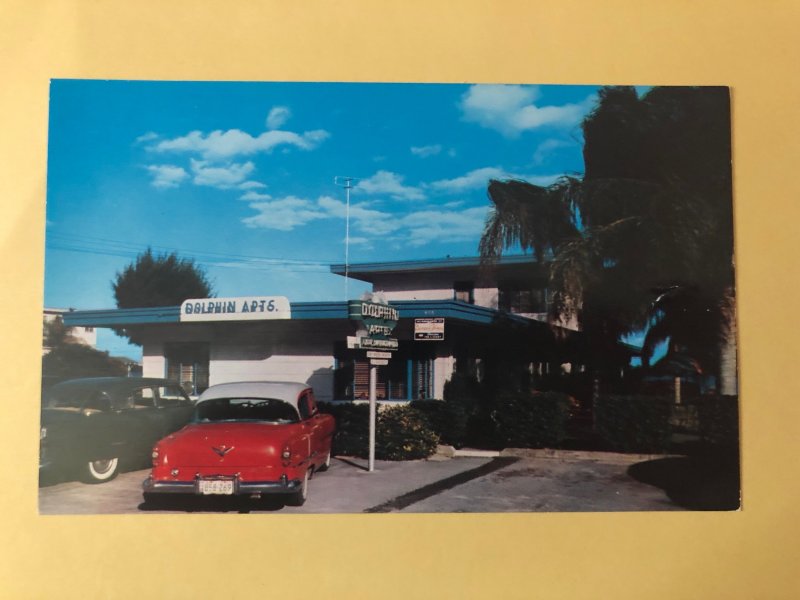 Dolphin Apartments with vintage cars on Clearwater Beach, Florida