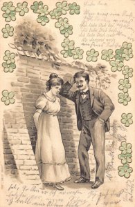 Romance Love 1903 Flirting Couple near Wall Flowers embossed postcard