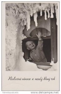 RP: Smiling Blond Boy Reaching Out Window to Touch Snowy Icicles 1960s