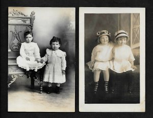 #115 RPPC 2 Cute Children on Large Chair, 2 Cute Children both Seated by window