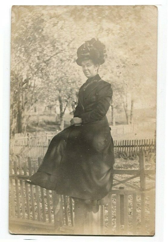 100812 RPPC Real Photo Postcard Woman Sitting on Fence - Big Hat Swisher IA