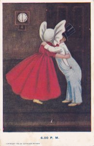 Girl wearing bonnet and boy wearing top hat kissing at 6:00 P.M. 1906