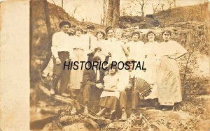 LARGE GROUP OF PEOPLE-MAN WITH ACCORDIAN-MUSIC GROUP?~1910s REAL PHOTO POSTCARD