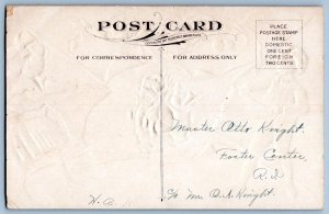 1910's CHILDREN UNWRAP SANTA CLAUS MERRY CHRISTMAS EMBOSSED ANTIQUE POSTCARD