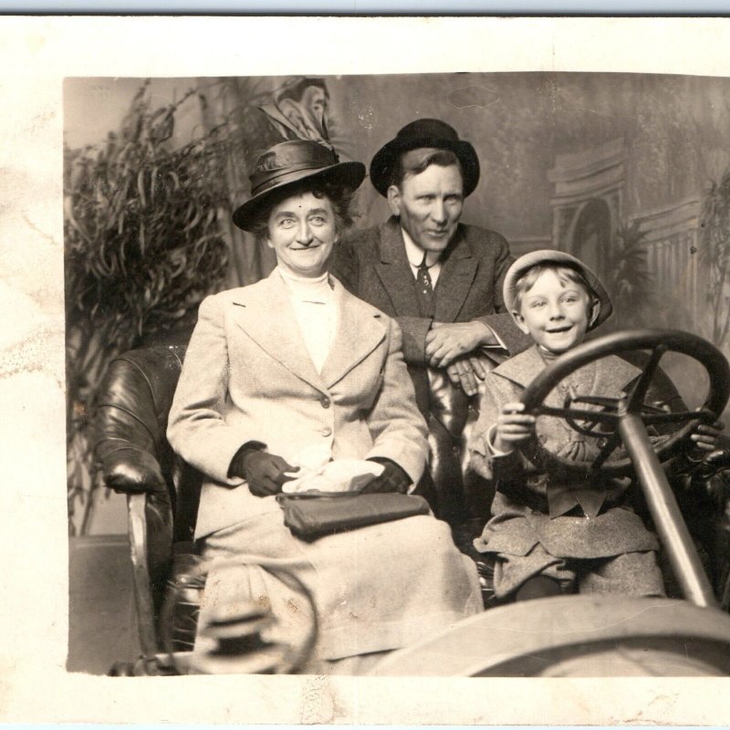 c1910s Happy Family in Studio Car RPPC Smile Young Boy Kid Drive Real Photo A162