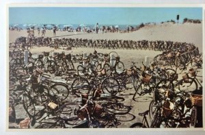 Nantucket Island, MA - beach scene crowded with bicycles